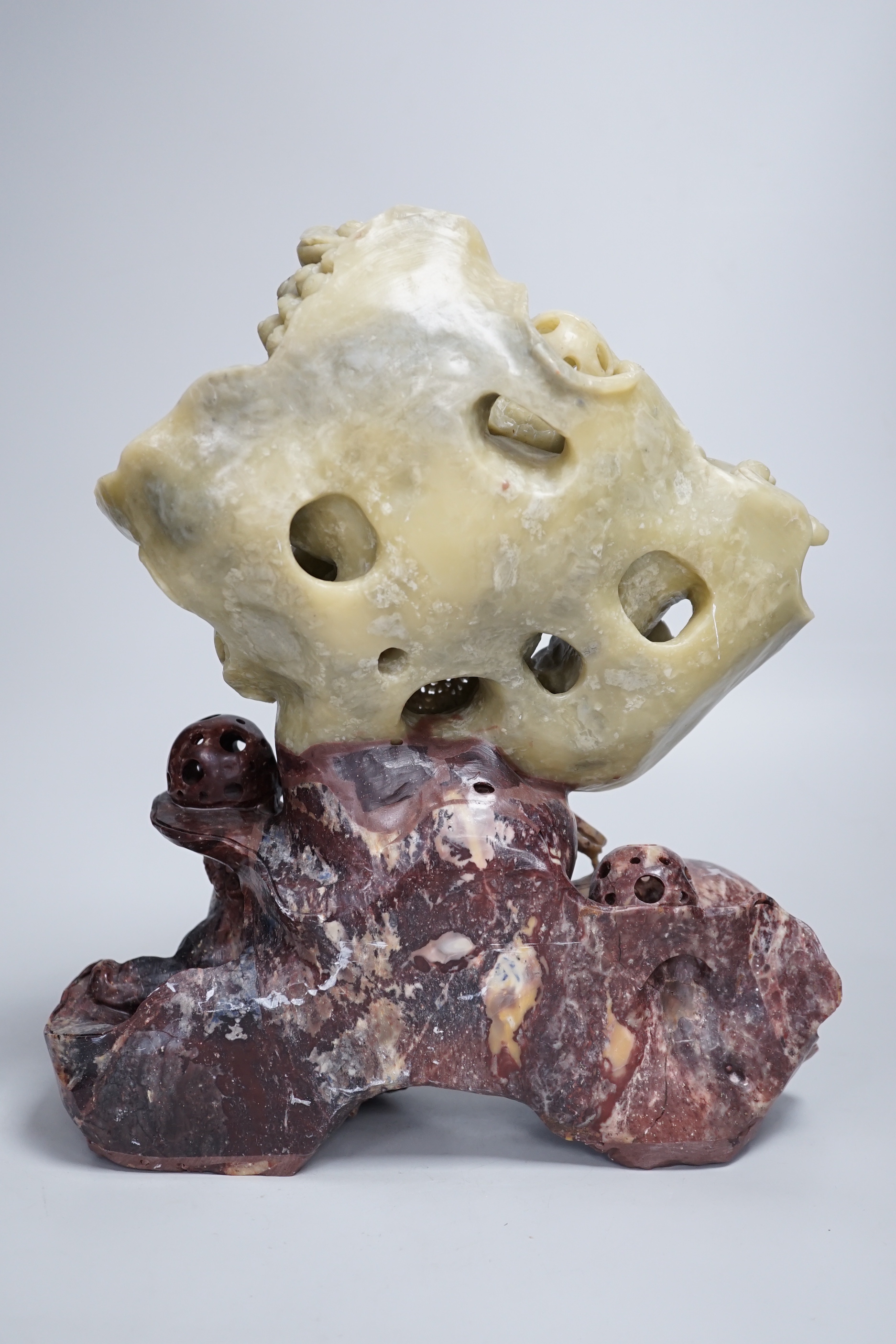 A Chinese soapstone sculpture of a lion dog group, 31.5cm high